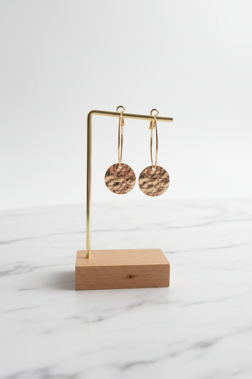 Hoop earrings with hammered circular pendant