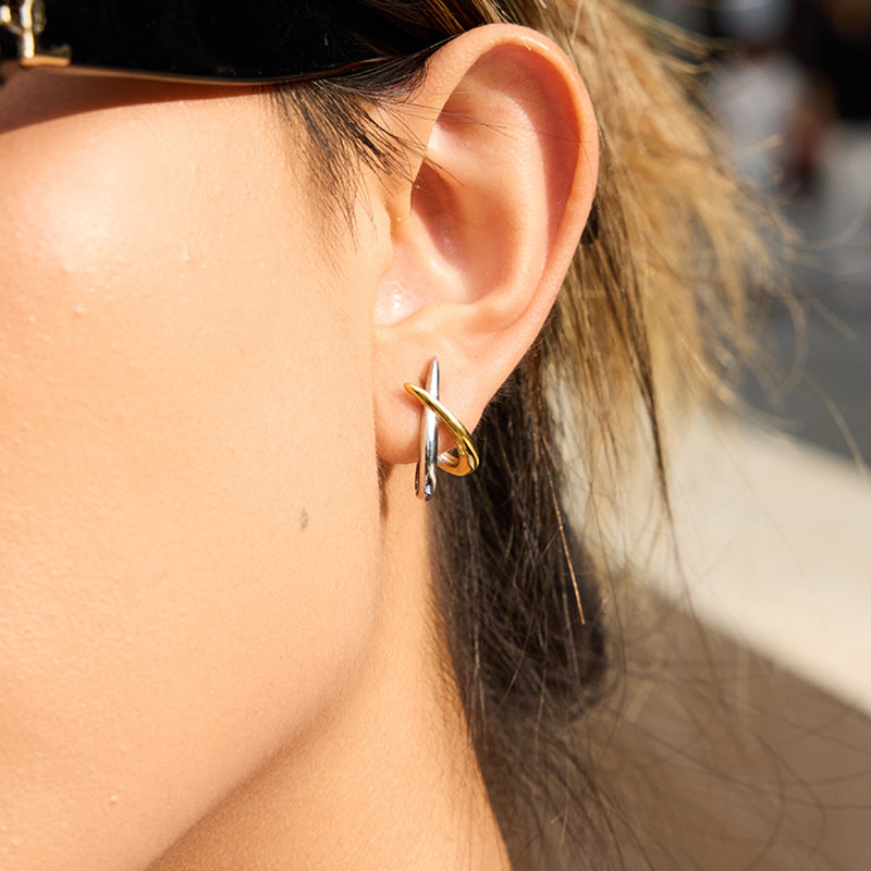 Dual tone cross over stud earrings