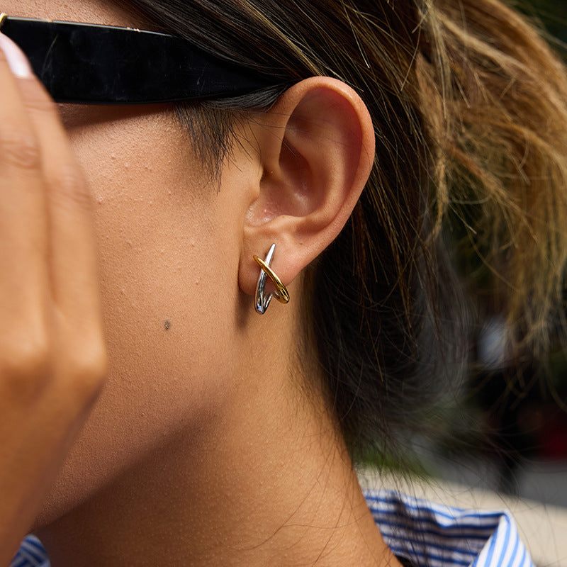 Dual tone cross over stud earrings
