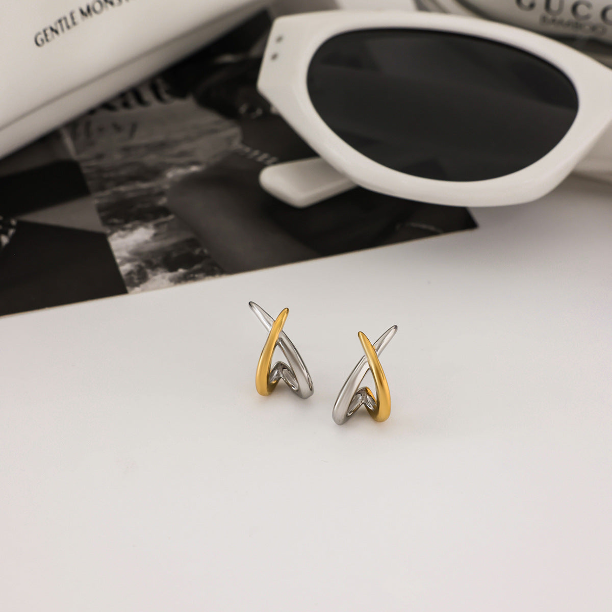 Dual tone cross over stud earrings