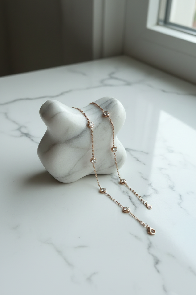 Delicate necklace with five circular encased Zirconia stones.