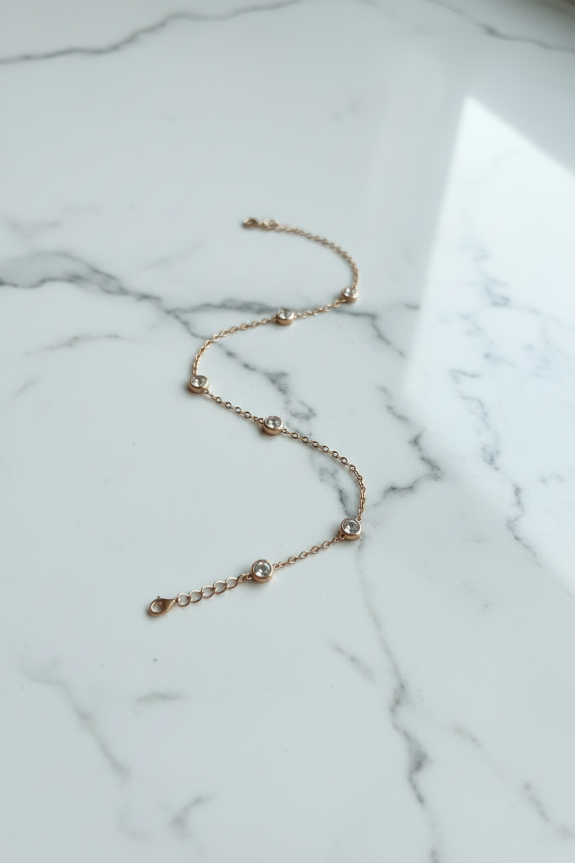 Delicate Geometric bracelet with six circular encased Zirconia stones