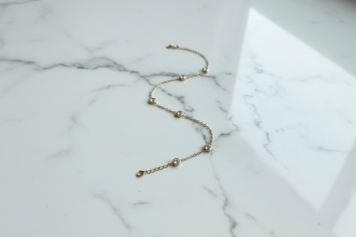 Delicate Geometric bracelet with six circular encased Zirconia stones