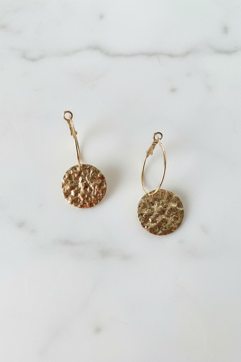 Hoop earrings with hammered circular pendant