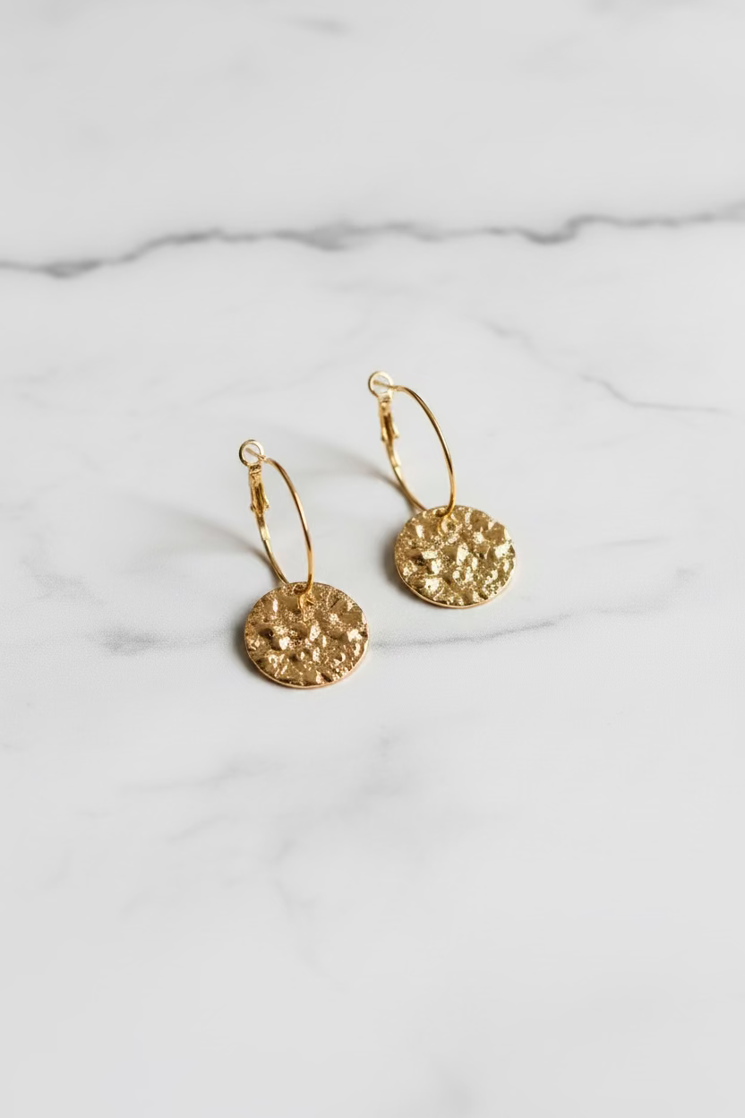 Hoop earrings with hammered circular pendant